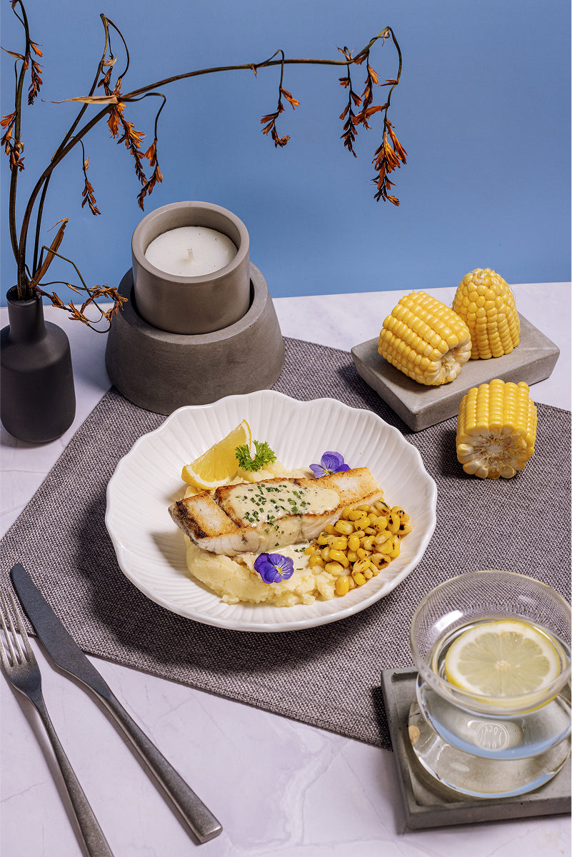 Garlic Cream Seabass with Truffle Potatoes and Grilled Corn
