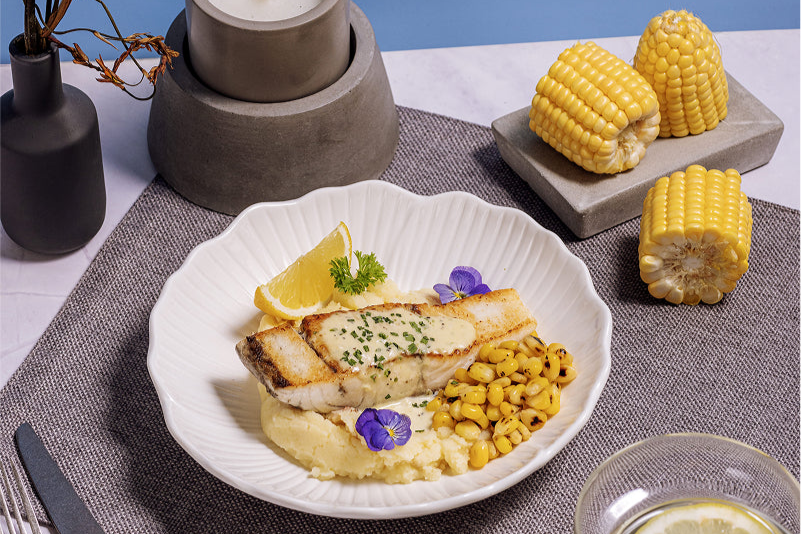 Garlic Cream Seabass with Truffle Potatoes and Grilled Corn